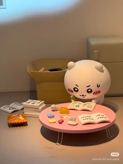 Cute Chiikawa studying hard at a pink table for Phone Background